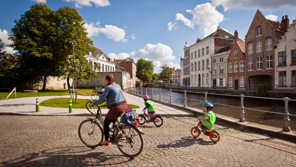 Bruges Cycling - Mother and Children at Canal Bruges Cycling - Mother and Children at Canal