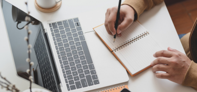 Photo of a person with a laptop Photo of a person with a laptop